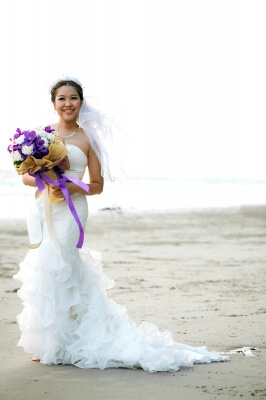 Bride with Flower Bouquet on the Beach