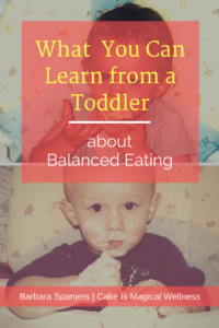 Toddler in high chair with yogurt covering face and hands. Text overlay, "What You Can Learn from a Toddler about Balanced Eating"