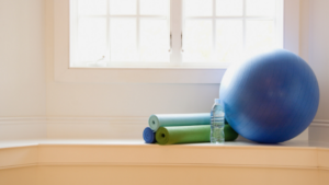 yoga ball and rolled up mats